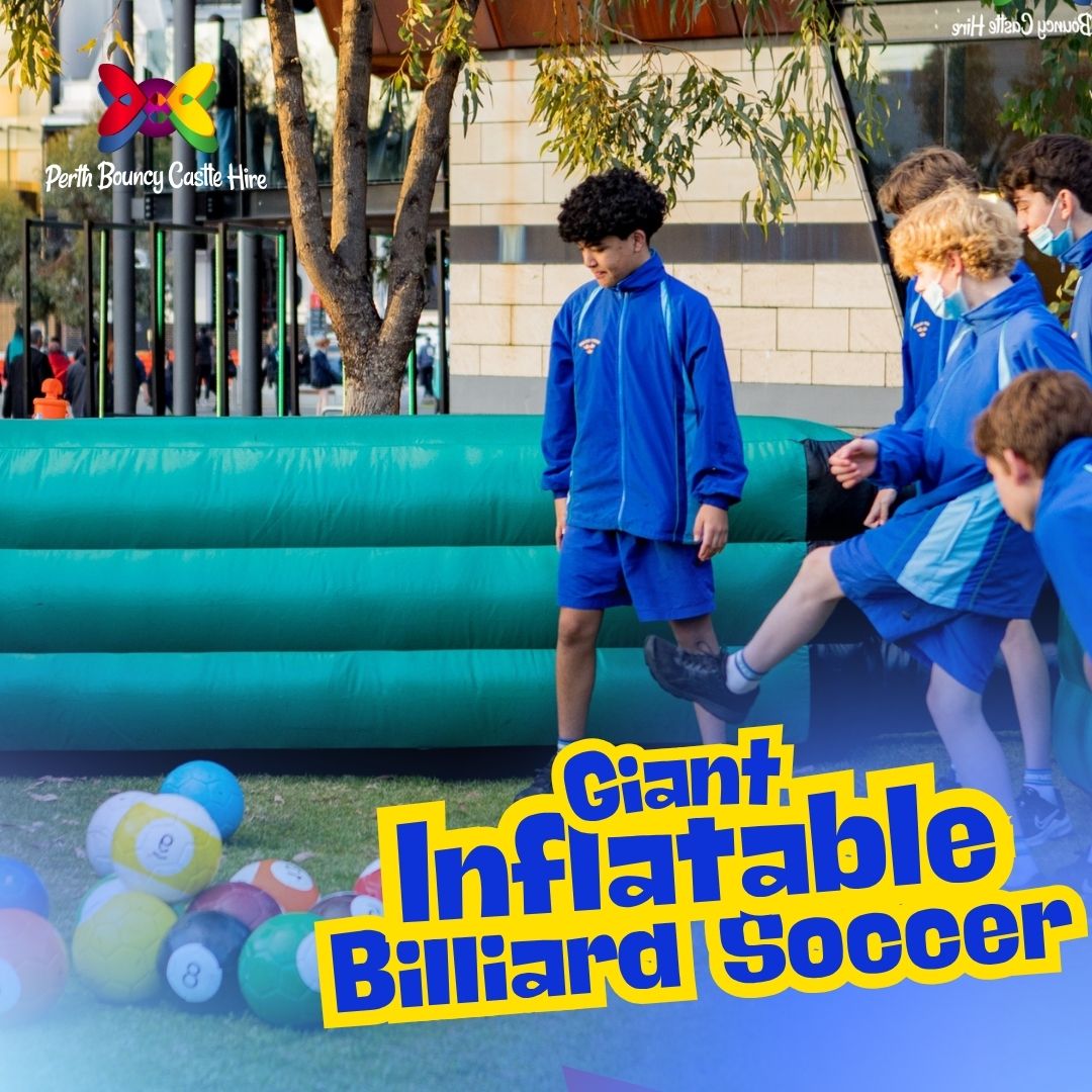 A group of students playing Giant Inflatable Billiard Soccer with a Perth Bouncy Castle Hire logo in the corner.