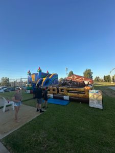 A person riding a mechanical bucking bull at an event in Cannington, Perth.