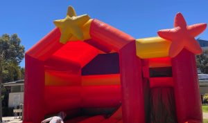 An inflatable bouncy house or ride named 'Superstar' at a special event in Claremont.