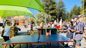 People playing table tennis at the outdoor tables in Fremantle Esplanade.