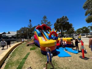 A large, inflatable "double super slide" set up as a dry slide at a Mandurah event.